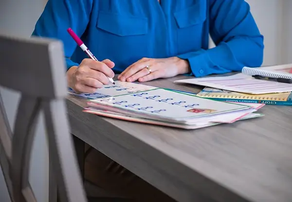 A speech-language pathologist writing notes