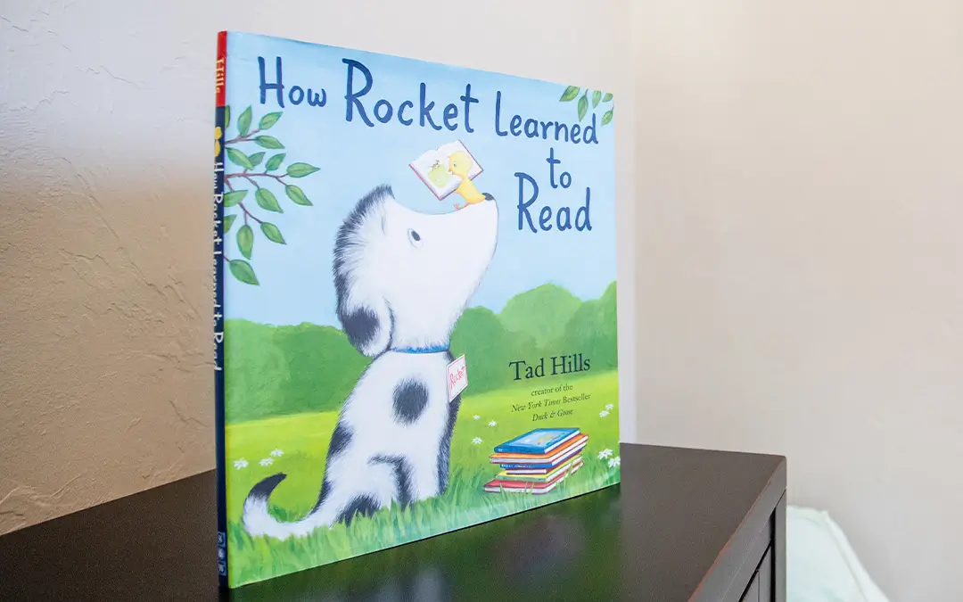 A children's picture book titled How Rocket Learned to Read.